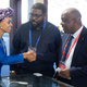 Hannah Wanjie Ryder is pictured shaking hands with delegates.